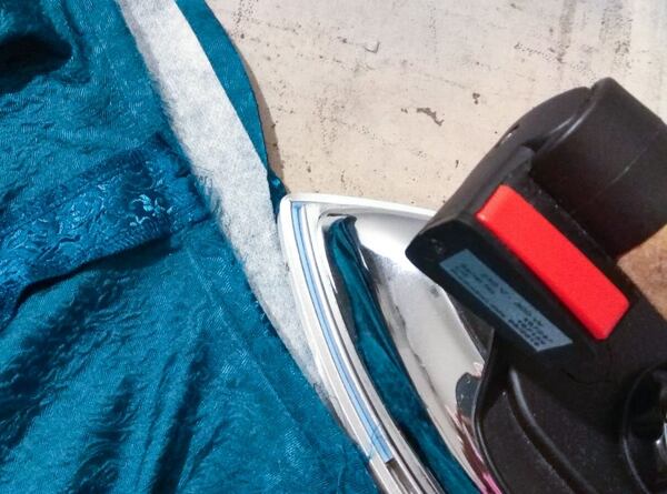 Ironing over the top of the waistband How to make a circle skirt — pressing down the upper edge